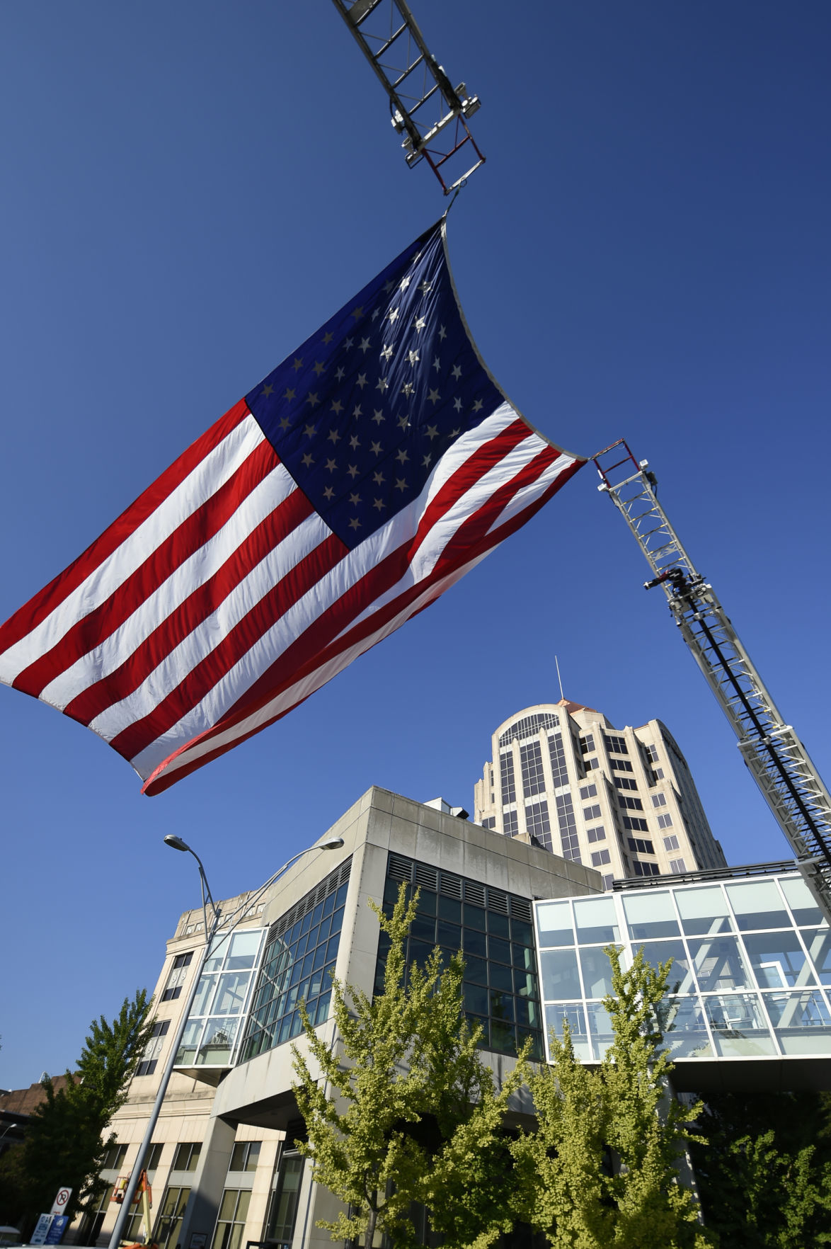 An oversized flag flies for Roanoke's 5th annual Memorial Stair Climb